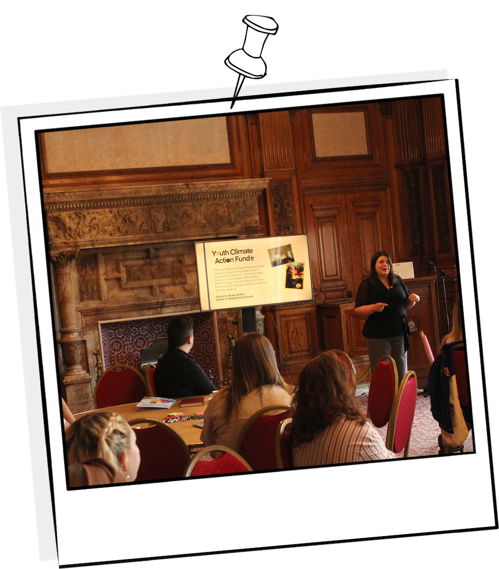 Polaroid photograph from the Youth Climate Action Fund kick-off event showing Council Leader Susan Aitken delivering a speech to the young people participating.